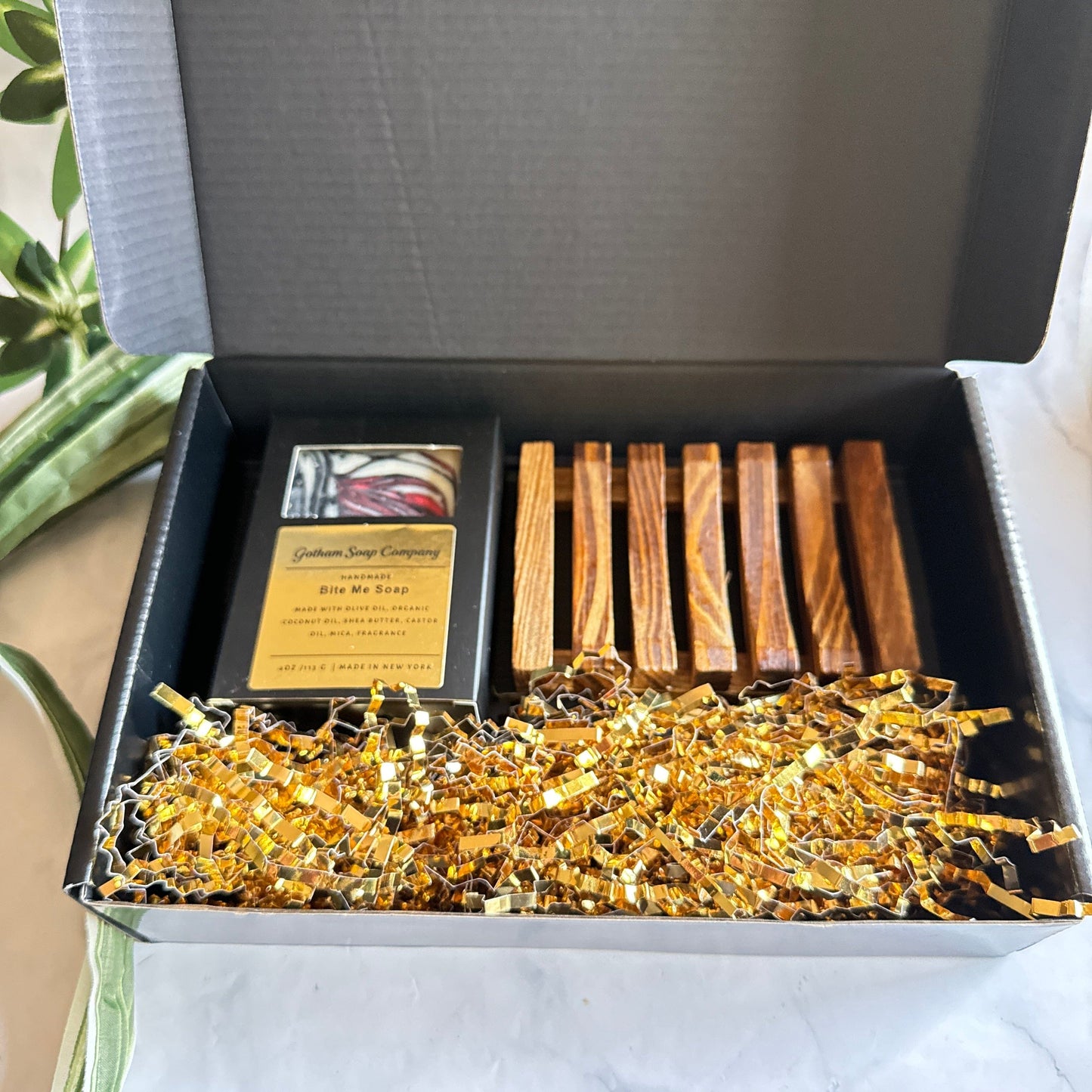 Gotham Soap Company Bite Me Gift Box soap bar in a box with a bamboo soap saved in a black box that’ says Gotham Soap. Company