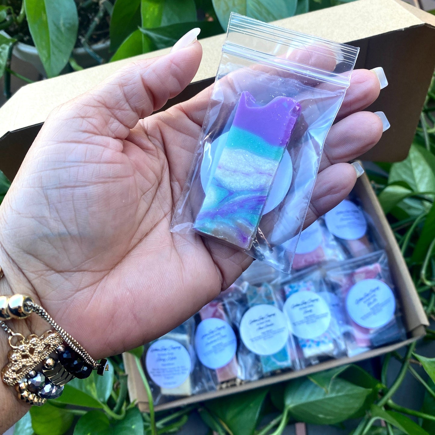 Gotham Soap Company Holding Soap Sample in Hand